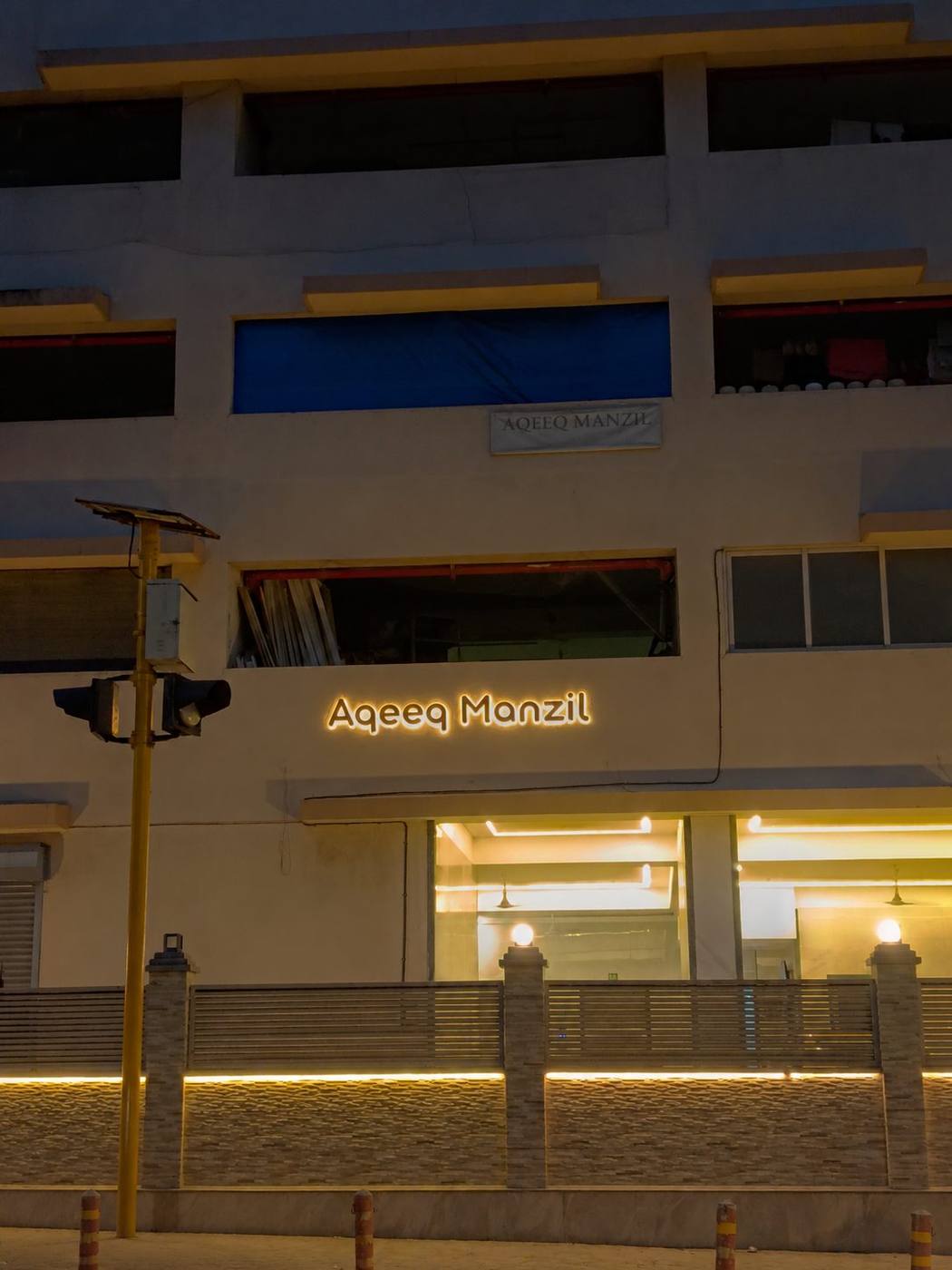 Aqeeq Manzil — night view